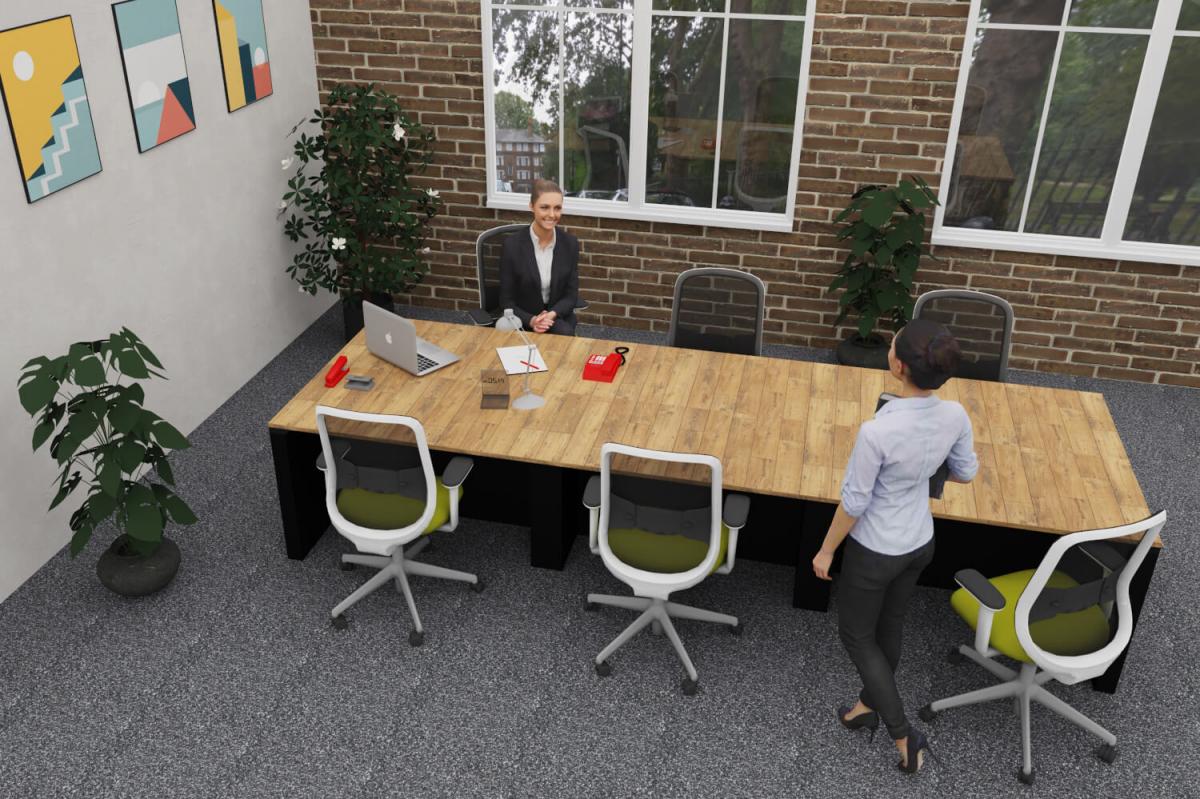 Two office workers sat at a Morph bench desk