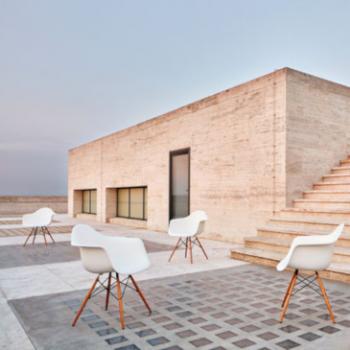 Eames plastic armchairs in white on rooftop