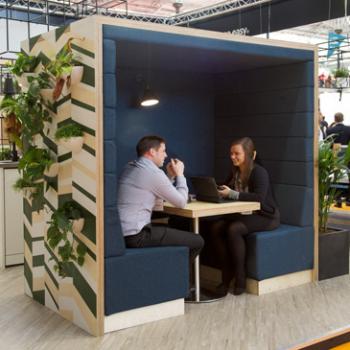 Railway carriage meeting pod with upholstered back