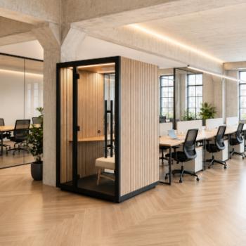 Work booth with wood slat exterio in middle of office