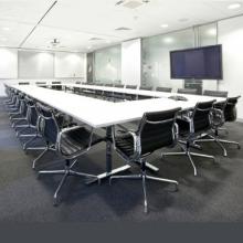 White Vivante 60 20 folding meeting table surrounded by black chairs